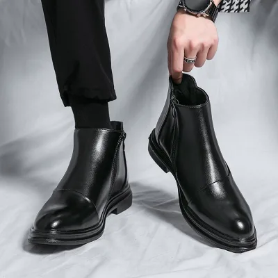 Photo of a men's black leather ankle boot model