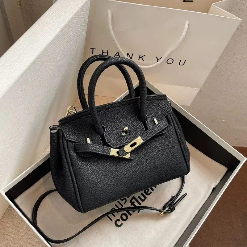 Purchase of authentic black women's hand and shoulder bags Buying an authentic black women's handbag and shoulder bag