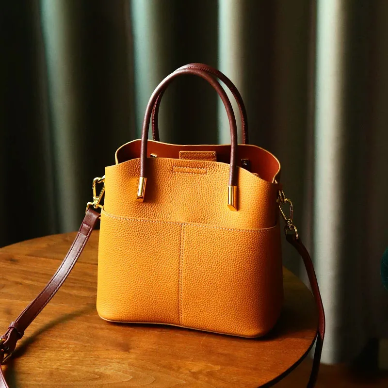 Photo of a women's leather handbag and shoulder bag, fashionable of the year Photo of a women's leather handbag and shoulder bag, trendy for the season