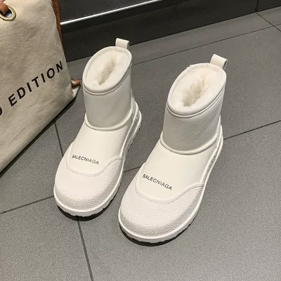 Photo of a white ankle boot model inside a women's fur coat, foreign