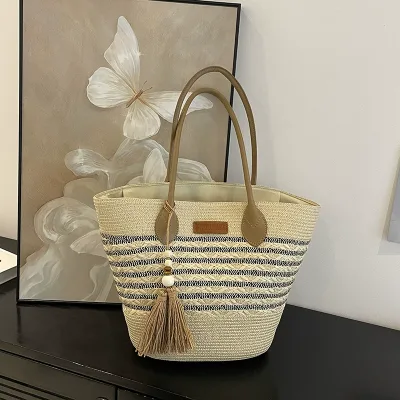 Price of women's handwoven and shoulder straw bags trending internationally