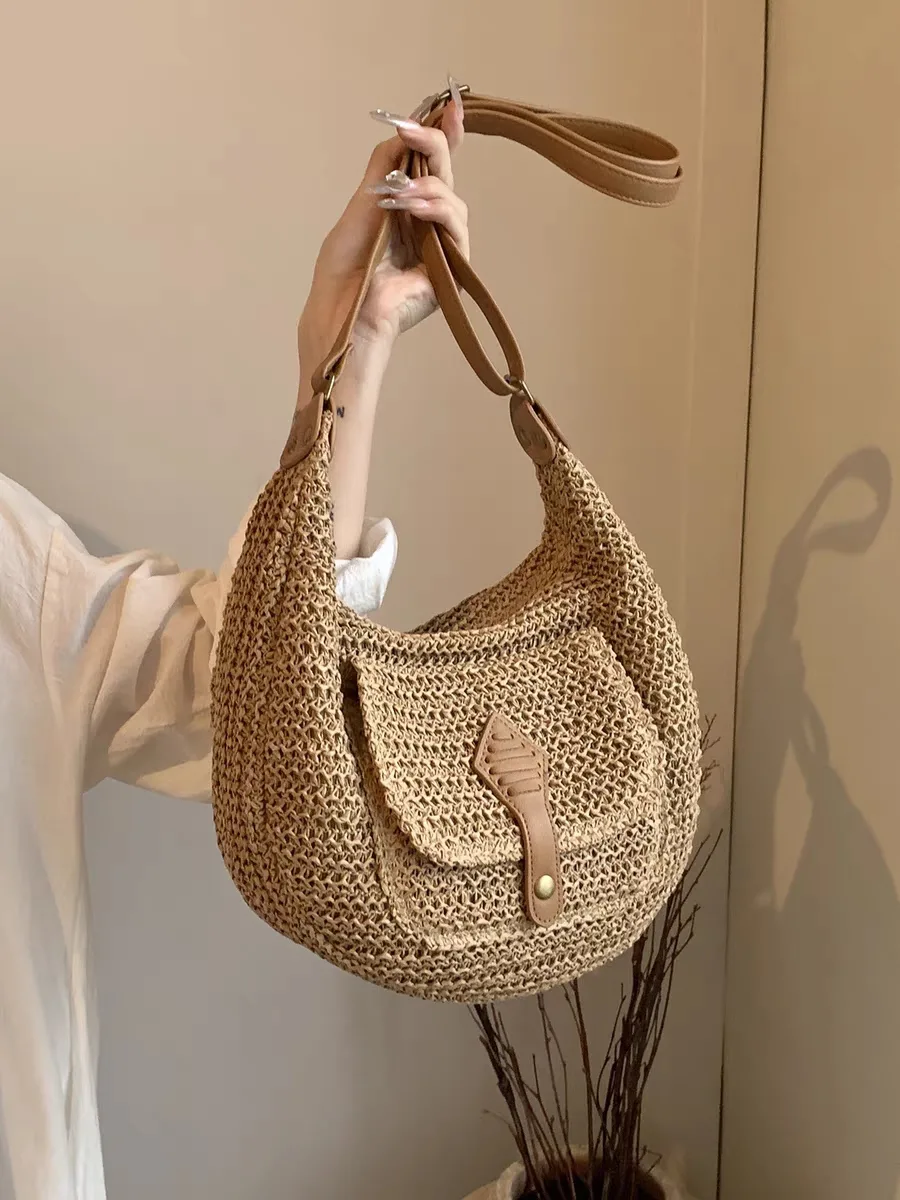 Photo of an original women's woven straw bag model Photo of an original women's wicker handbag model