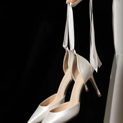 Photo of a white wedding shoe model with ribbon straps, trending internationally