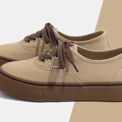 Price of women's and girls' original Vans-style shoes in cream and brown.
