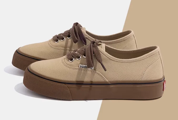 Price of women's and girls' original Vans-style shoes in cream and brown. Price of women's and girls' original Vans-style shoes in cream and brown.