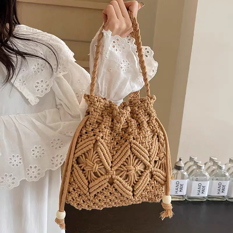 Photo of a hand-knit and crocheted brown bag, both shoulder and handbag styles, trendy for girls and women, international style Photo of a hand-knit and crocheted brown bag, suitable for girls and women, trendy internationally.