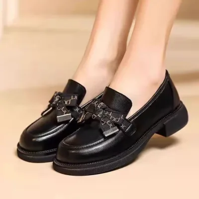 Photo of women's black loafers with platform heel, ModSal.