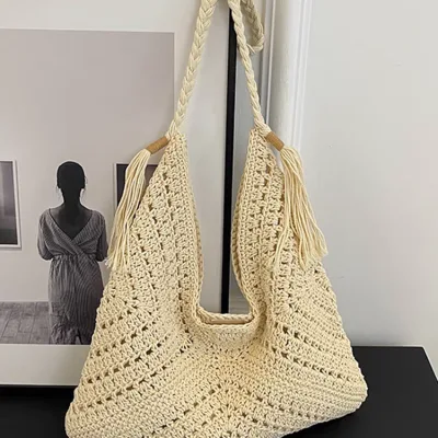 Photo of a handmade knitted shoulder bag with mesh design for girls and women, foreign.