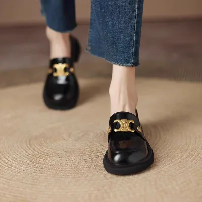 Photo of a women's and girls' patent leather loafer shoe model