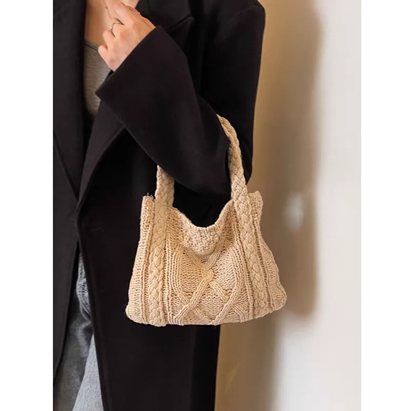 Price of handmade beige knitted bag with twisted braid for girls and women, authentic Price of handmade beige knitted bag with twisted weave for girls and women, genuine