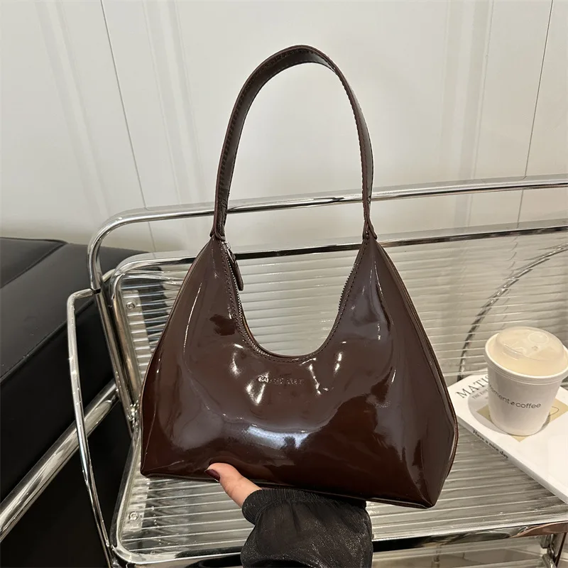 Women's and girls' external brown leather shoulder bag model Women's and girls' external leather shoulder bag model in brown.